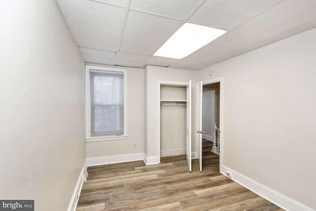 3339 N 21st St, Philadelphia, PA 19140 - unfurnished bedroom with a drop ceiling, a closet, and wood finished floors