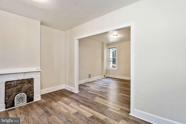 3339 N 21st St, Philadelphia, PA 19140 - unfurnished living room with wood finished floors and a fireplace