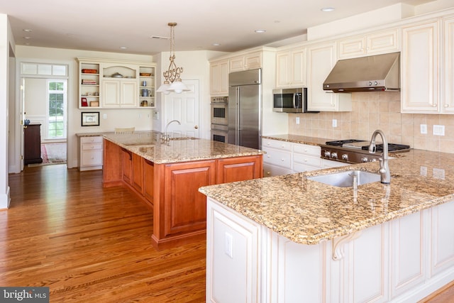 211 Twinings Ln, Wayne, PA 19087 - kitchen with ventilation hood, stainless steel appliances, light wood-style flooring, a peninsula, and open shelves
