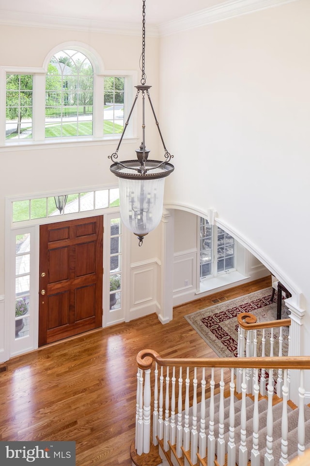 211 Twinings Ln, Wayne, PA 19087 - foyer entrance with wood finished floors, plenty of natural light, and crown molding