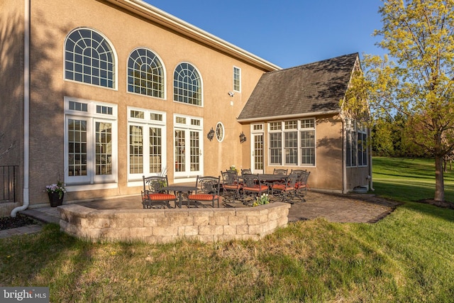 211 Twinings Ln, Wayne, PA 19087 - rear view of house featuring a lawn, a patio area, and stucco siding