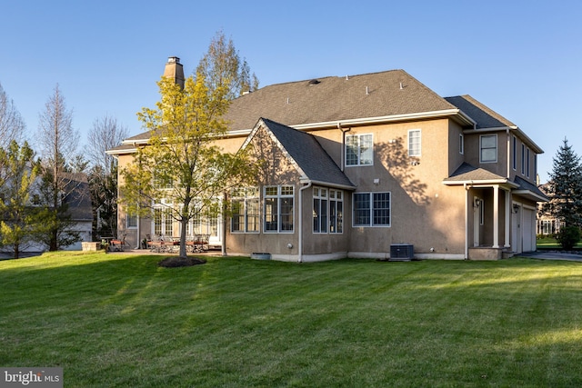 211 Twinings Ln, Wayne, PA 19087 - rear view of property featuring a chimney, a yard, stucco siding, and a shingled roof