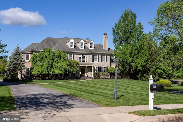 211 Twinings Ln, Wayne, PA 19087 - georgian-style home featuring a chimney and a front yard