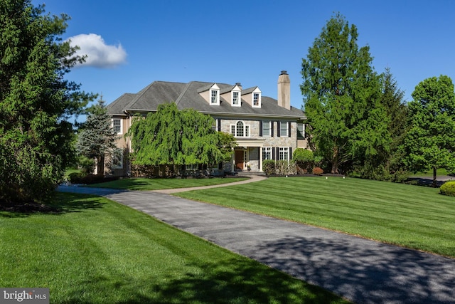 211 Twinings Ln, Wayne, PA 19087 - colonial-style house with a chimney and a front yard