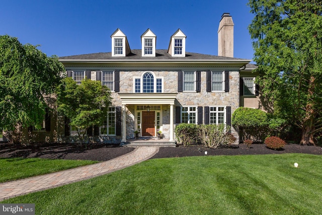 211 Twinings Ln, Wayne, PA 19087 - colonial inspired home featuring stone siding, a chimney, and a front yard
