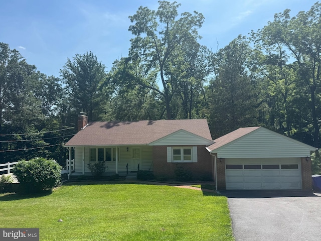 5149 Shookstown Rd, Frederick, MD 21702 - single story home with asphalt driveway, a front lawn, a porch, a garage, and a chimney
