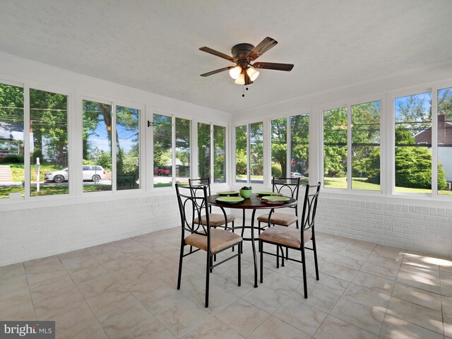 10109 Lorain Ave, Silver Spring, MD 20901 - sunroom with plenty of natural light, brick wall, tile patterned flooring, and french doors