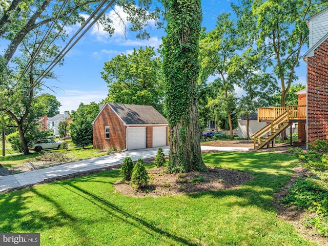 10109 Lorain Ave, Silver Spring, MD 20901 - view of grassy yard with an outbuilding, stairs, a garage, a deck, and concrete driveway