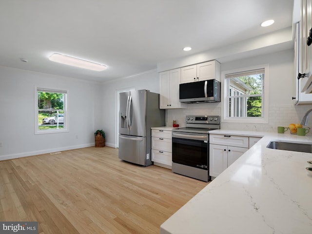 10109 Lorain Ave, Silver Spring, MD 20901 - kitchen with appliances with stainless steel finishes, decorative backsplash, healthy amount of natural light, recessed lighting, and ornamental molding