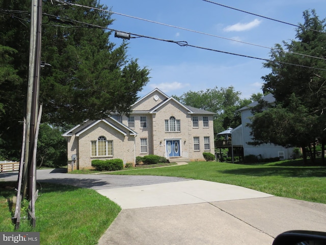 13937 Alderton Rd, Silver Spring, MD 20906 - view of front of house with brick siding and a front lawn