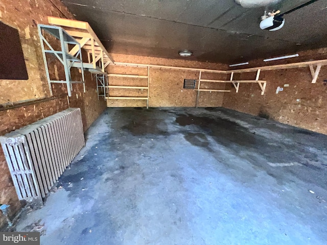 733 Saint Paul Rd, Meyersdale, PA 15552 - garage with radiator heating unit and a garage door opener