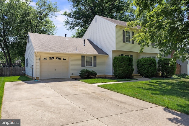 269 Burning Tree Rd, Delran, NJ 08075 - colonial house featuring a garage, driveway, and roof with shingles