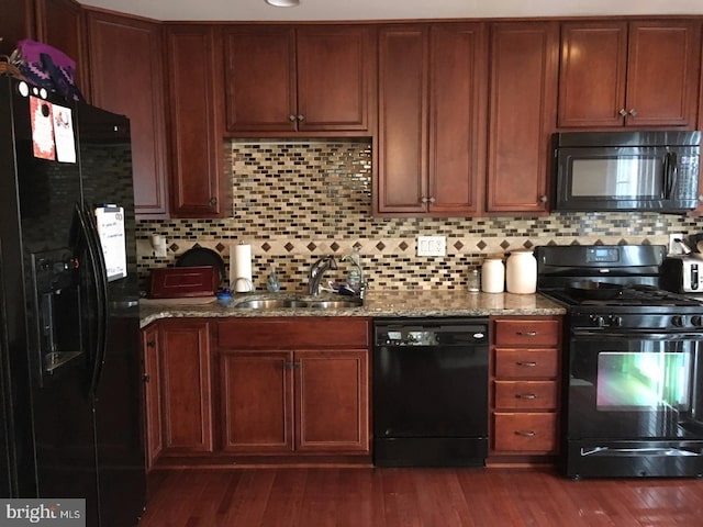 233 Flagstone Rd Unit 5, Chester Springs, PA 19425 - kitchen featuring black appliances, stone counters, dark wood finished floors, and backsplash