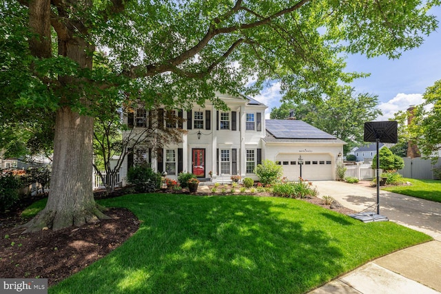 8327 Fran Ct, Lorton, VA 22079 - view of front of home featuring solar panels, a garage, and concrete driveway