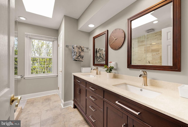 8327 Fran Ct, Lorton, VA 22079 - bathroom featuring double vanity, a skylight, tiled shower, and recessed lighting
