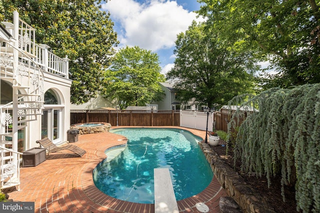 8327 Fran Ct, Lorton, VA 22079 - view of swimming pool with an in-ground hot tub, a fenced backyard, a patio, and a diving board