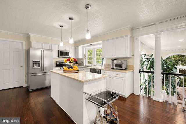 8327 Fran Ct, Lorton, VA 22079 - kitchen featuring appliances with stainless steel finishes, white cabinets, decorative columns, dark wood-type flooring, and light stone counters