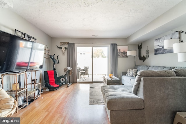 689 Colony Dr, York, PA 17404 - living area with wood finished floors and a textured ceiling