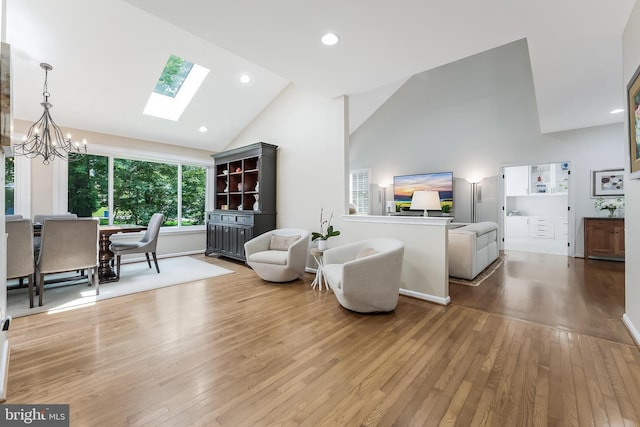 12801 Owlsley Way, Herndon, VA 20171 - living room with a chandelier, hardwood / wood-style flooring, a skylight, high vaulted ceiling, and recessed lighting