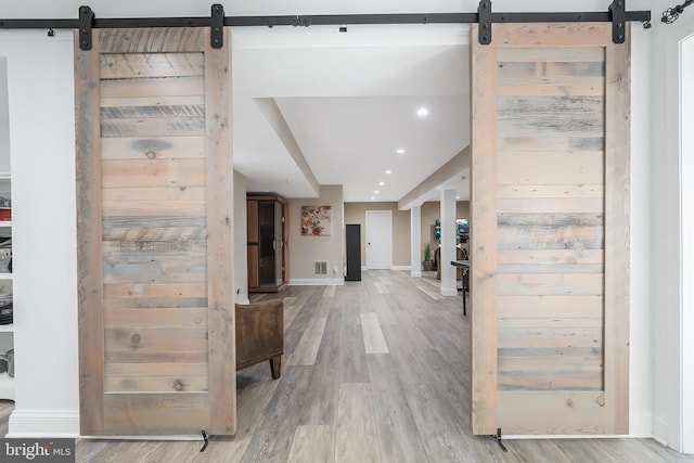 12801 Owlsley Way, Herndon, VA 20171 - hall featuring a barn door, recessed lighting, and light wood-type flooring