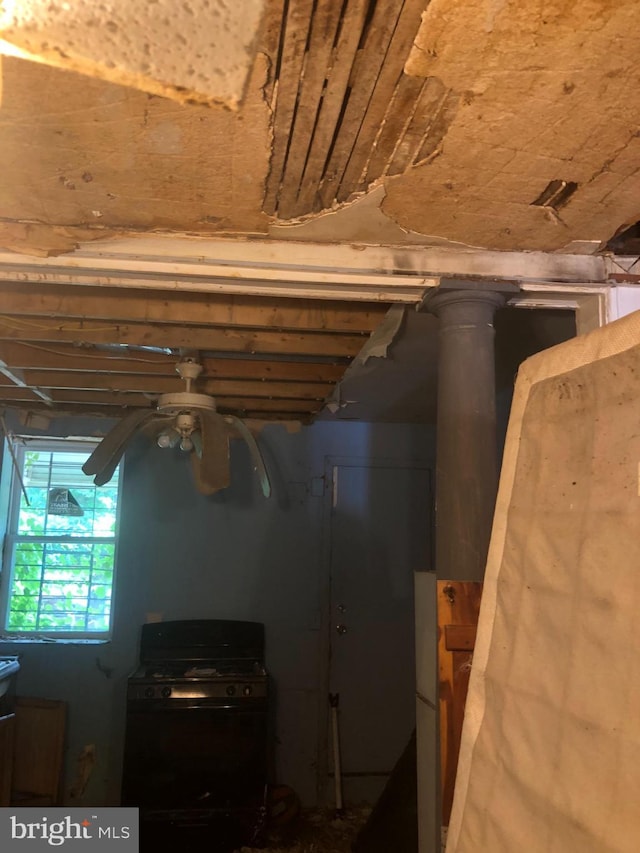 1730 Mckean Ave, Baltimore, MD 21217 - detailed view of black range with gas stovetop and a ceiling fan