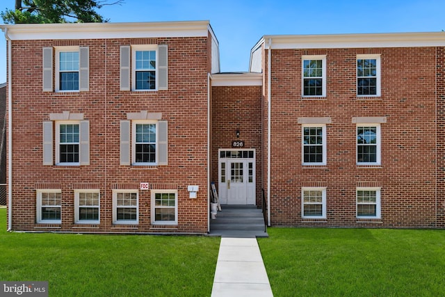 826 Quince Orchard Blvd Unit 101, Gaithersburg, MD 20878 - view of front facade featuring brick siding and a front lawn
