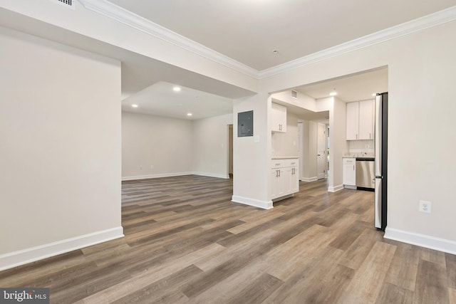 826 Quince Orchard Blvd Unit 101, Gaithersburg, MD 20878 - unfurnished living room with ornamental molding, electric panel, wood finished floors, and recessed lighting
