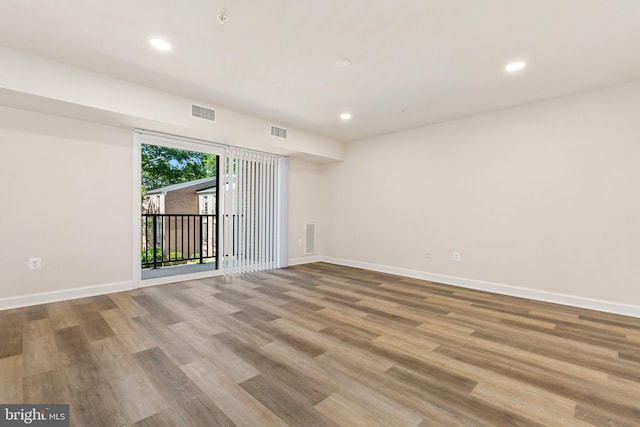 826 Quince Orchard Blvd Unit 101, Gaithersburg, MD 20878 - spare room featuring wood finished floors and recessed lighting