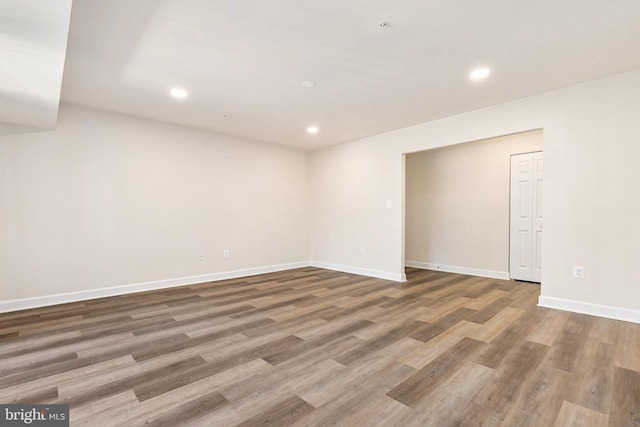 826 Quince Orchard Blvd Unit 101, Gaithersburg, MD 20878 - empty room with wood finished floors and recessed lighting