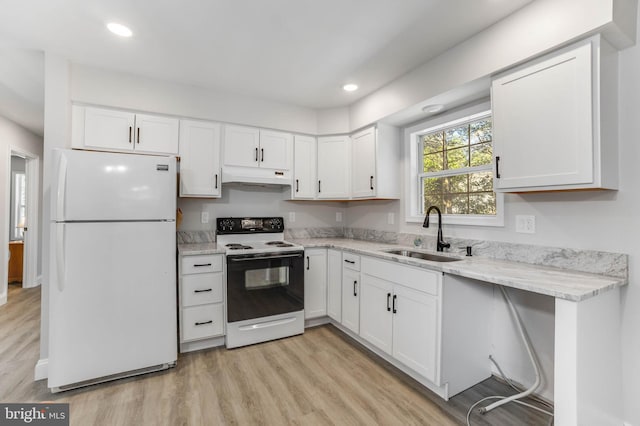 6508 Millcreek Rd, Laurel, DE 19956 - kitchen with freestanding refrigerator, range with electric cooktop, under cabinet range hood, white cabinets, and recessed lighting
