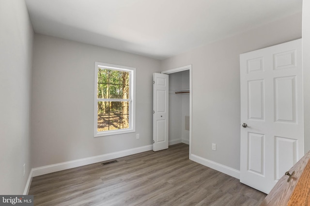 6508 Millcreek Rd, Laurel, DE 19956 - unfurnished bedroom with wood finished floors and a closet
