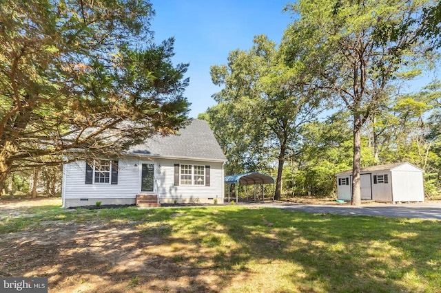 6508 Millcreek Rd, Laurel, DE 19956 - view of front of property featuring crawl space, a storage shed, a carport, a front lawn, and driveway