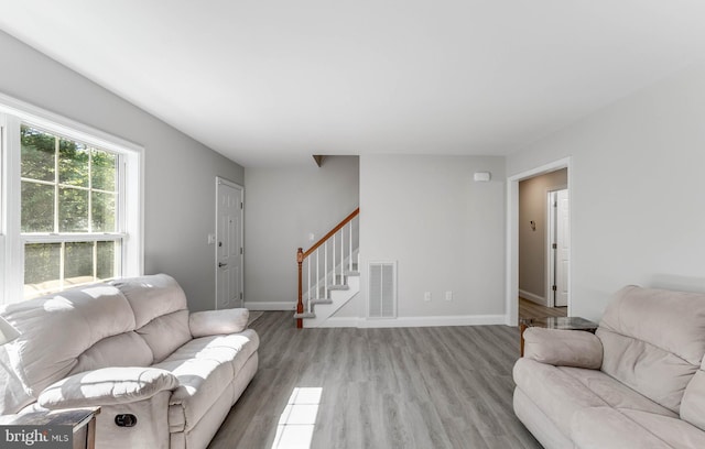 6508 Millcreek Rd, Laurel, DE 19956 - living room featuring stairs and light wood-style flooring
