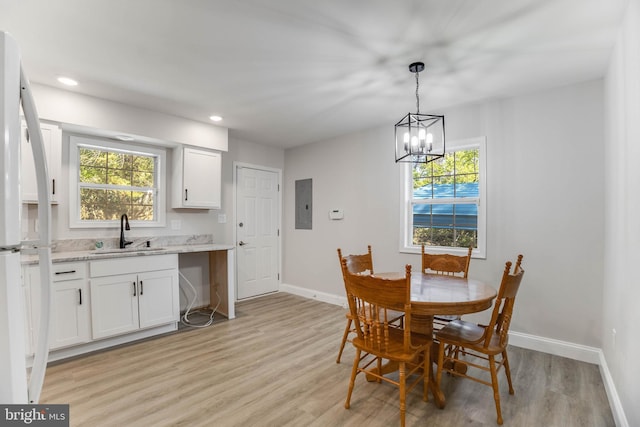 6508 Millcreek Rd, Laurel, DE 19956 - dining space with light wood-style flooring, recessed lighting, a chandelier, and electric panel