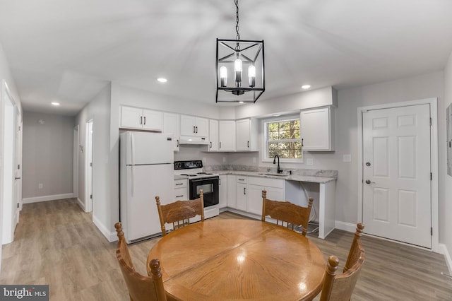 6508 Millcreek Rd, Laurel, DE 19956 - kitchen with freestanding refrigerator, electric range oven, under cabinet range hood, a chandelier, and white cabinetry