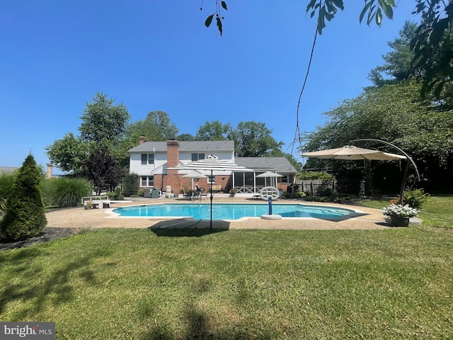 14311 Shelter Ln, Haymarket, VA 20169 - rear view of house featuring a patio, an outdoor pool, and a chimney