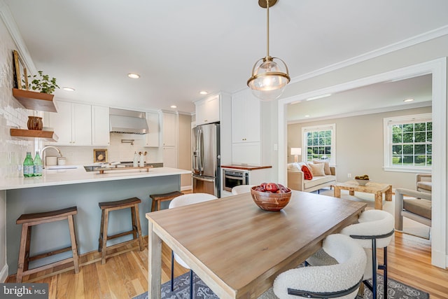 1930 Foxhall Rd, Mclean, VA 22101 - dining space with light wood finished floors, ornamental molding, and recessed lighting
