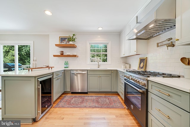 1930 Foxhall Rd, Mclean, VA 22101 - kitchen featuring appliances with stainless steel finishes, wall chimney range hood, beverage cooler, backsplash, and ornamental molding