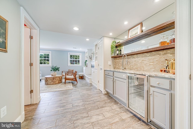 1930 Foxhall Rd, Mclean, VA 22101 - indoor wet bar featuring wine cooler, recessed lighting, light wood-style flooring, and backsplash