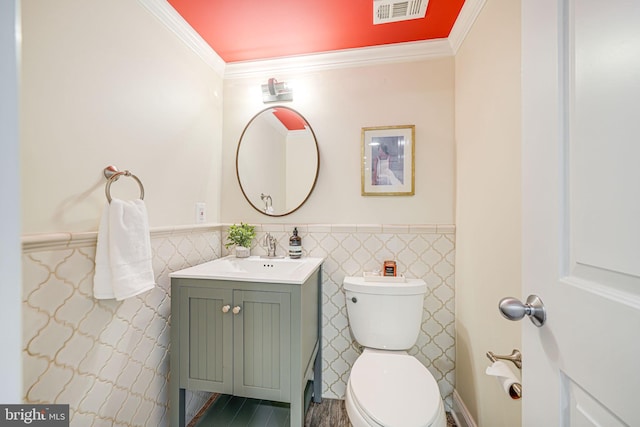 1930 Foxhall Rd, Mclean, VA 22101 - half bathroom with vanity, wainscoting, ornamental molding, and tile walls