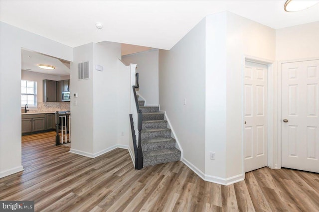 1806 Wheyfield Dr, Frederick, MD 21701 - stairway featuring wood finished floors and baseboards
