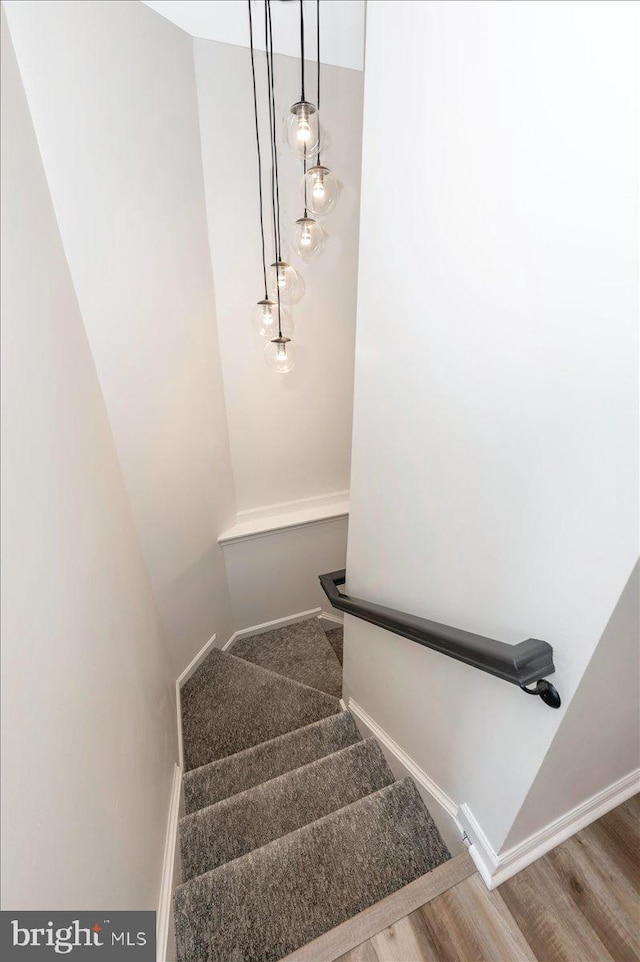 1806 Wheyfield Dr, Frederick, MD 21701 - stairs with wood finished floors and baseboards