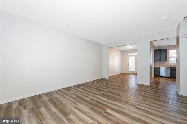 1806 Wheyfield Dr, Frederick, MD 21701 - unfurnished living room with wood finished floors and baseboards