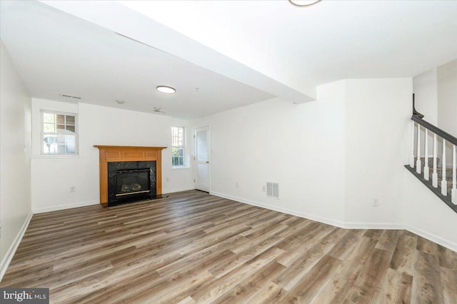 1806 Wheyfield Dr, Frederick, MD 21701 - unfurnished living room with stairway, wood finished floors, and a high end fireplace