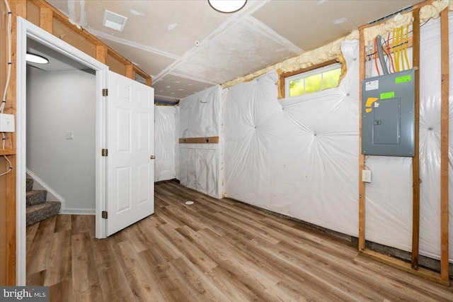 1806 Wheyfield Dr, Frederick, MD 21701 - below grade area with electric panel, wood finished floors, and stairs
