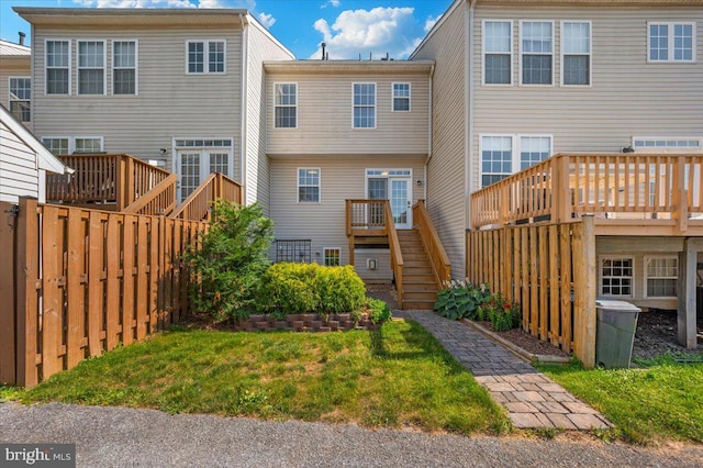 1806 Wheyfield Dr, Frederick, MD 21701 - back of house featuring stairs, a wooden deck, and a lawn