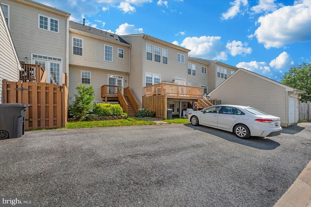 1806 Wheyfield Dr, Frederick, MD 21701 - rear view of house with stairs, a residential view, a deck, and a garage