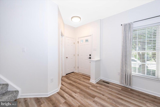 1806 Wheyfield Dr, Frederick, MD 21701 - entryway featuring light wood-style flooring, healthy amount of natural light, and stairs
