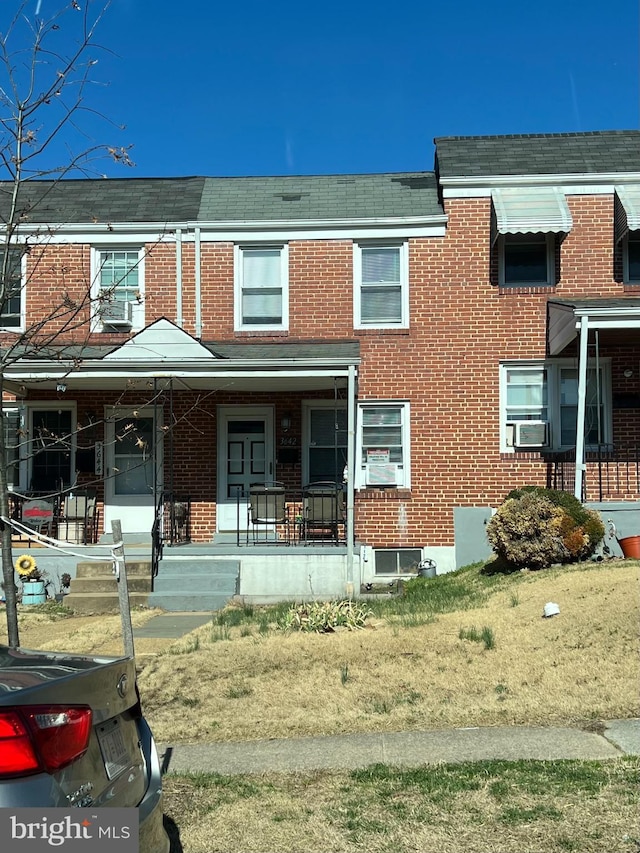 3642 Clarenell Rd, Baltimore, MD 21229 - townhome / multi-family property featuring brick siding, a porch, and cooling unit