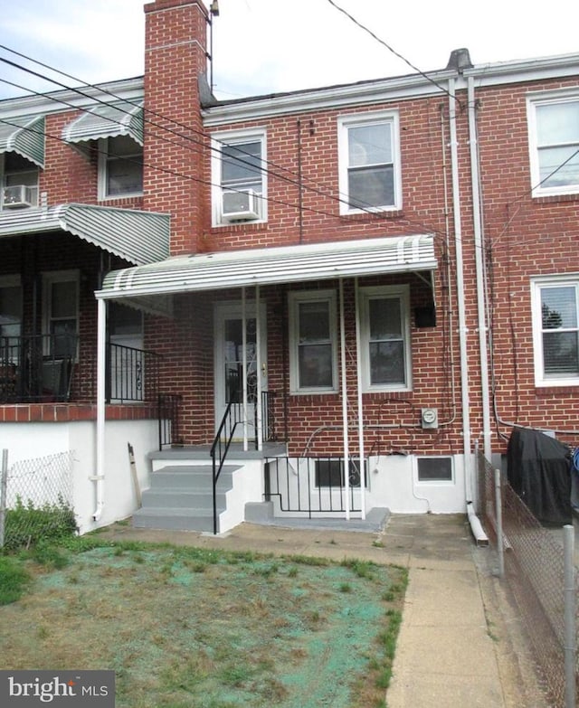 3642 Clarenell Rd, Baltimore, MD 21229 - view of front of home featuring brick siding and a chimney